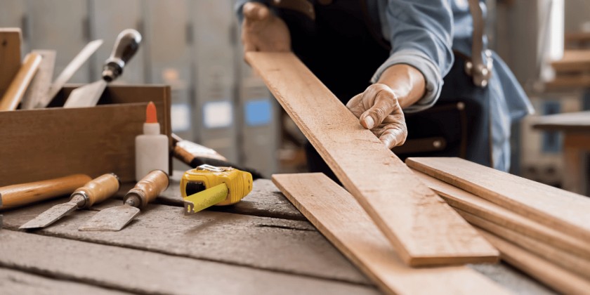 Professional movers fixing and setting up furniture in a Dubai apartment
