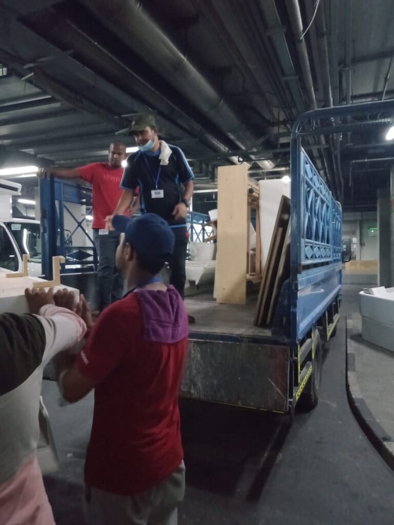 Team removing old sofa and furniture from a home in Dubai