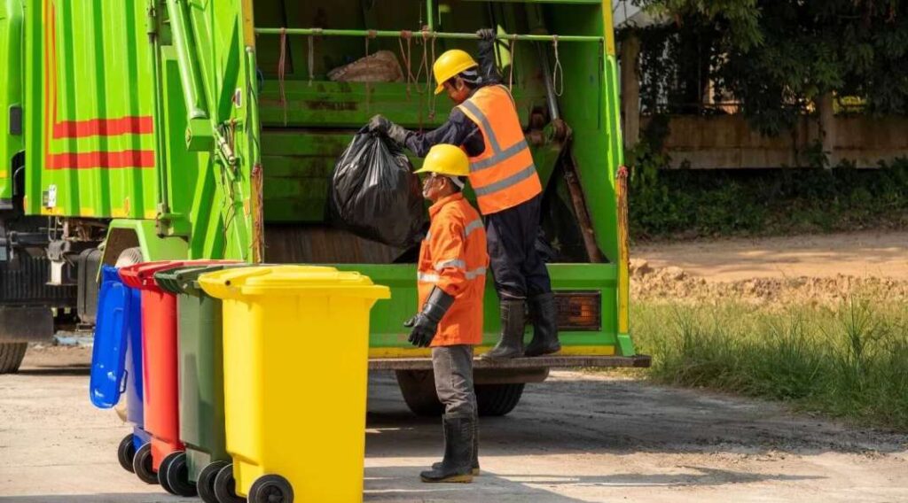 Licensed rubbish removal company crew loading waste into a certified truck in Dubai