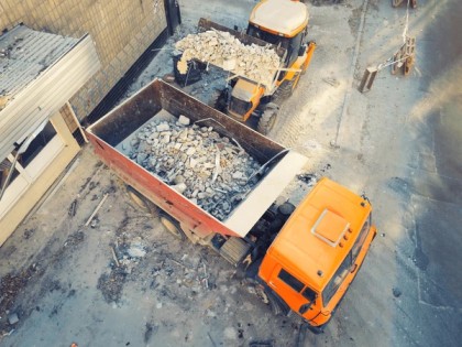 Rubbish removal crew loading junk onto a truck during a weekend in Dubai